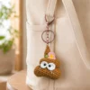 Handmade crochet poop-shaped keychain charm