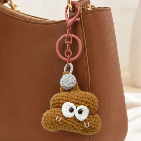 Handmade crochet poop-shaped keychain charm